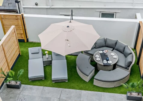 The enclosed courtyard garden & alfresco dining area at Stone Bay, Westward Ho!