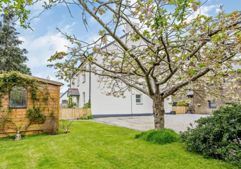 The grassy area opposite the cottage at Stonehaven at Woolmers House, Bickington