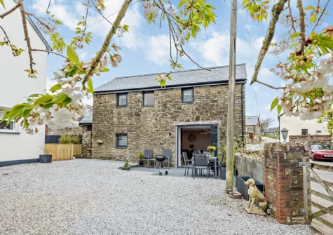 The patio, barbecue, alfresco dining area & private parking for two cars at Stonehaven at Woolmers House, Bickington