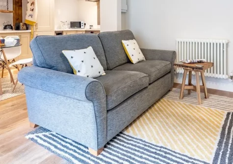 Stones Throw, Charlestown is a charming ground-floor retreat with original granite beams, moments from the historic harbour. Enjoy modern comforts, wine chiller, coastal walks, and access to Poldark filming locations, perfect for couples.