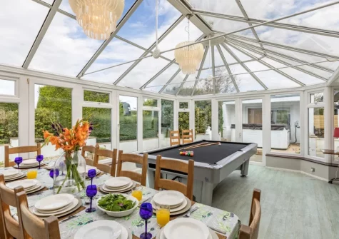 The conservatory dining area at Stonewold, Buckland Brewer
