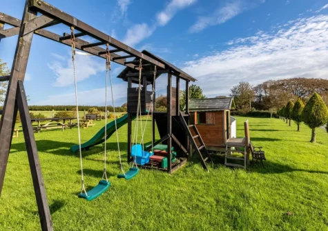 The spacious garden with children's play & climbing area at Stonewold, Buckland Brewer