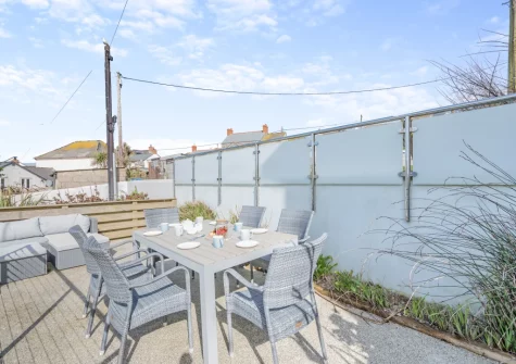 The pebbled patio, alfresco dining & outdoor sitting area at Stormgazer, Porthleven