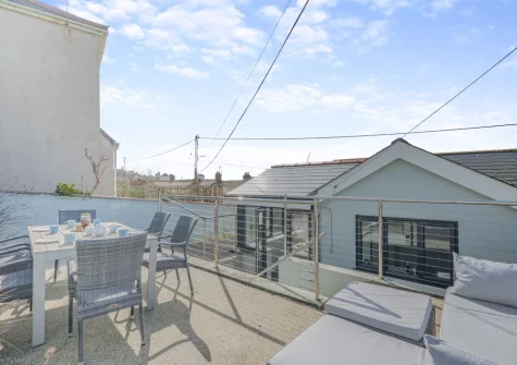 The pebbled patio, alfresco dining & outdoor sitting area at Stormgazer, Porthleven