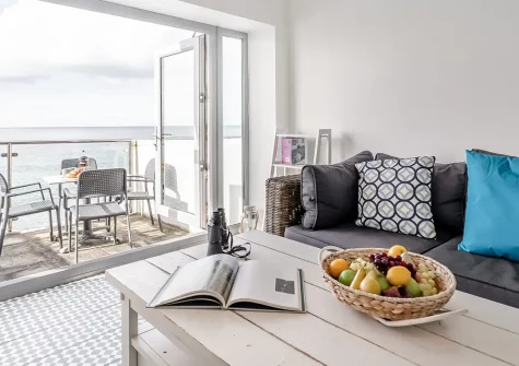 Stormgazer, Porthleven is a beautifully refurbished three-bedroom cottage with a private sunroom overlooking the beach. Enjoy coastal charm, modern comforts, and direct beach access. It's perfect for creating unforgettable family seaside memories.