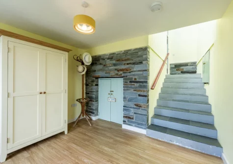 The entrance area & stairs up to the first floor at Stradav, Polzeath