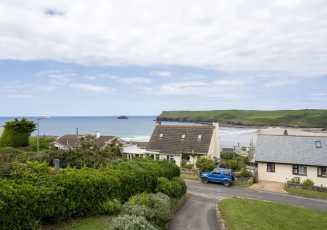The view of Polzeath Beach from the front-facing balcony & alfresco dining area at Stradav, Polzeath