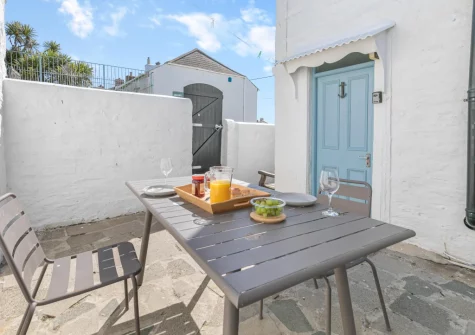The enclosed patio & alfresco dining area at Suffolk Cottage, Porthleven