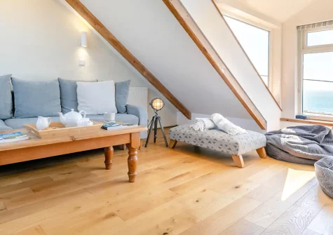 Suffolk Cottage, Porthleven is a charming 2-bedroom traditional retreat blending original Cornish character with modern comforts. Enjoy stunning sea views from the spectacular attic room, enclosed patio dining, and prime harbour location.