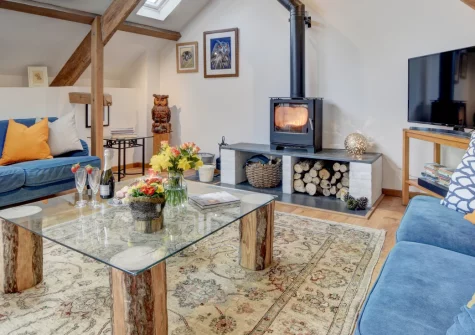 Summercombe, Berrynarbor is a stunning Grade II-listed barn conversion set within a 60-acre rewilding project, featuring elegant interiors with vaulted ceilings and oak beams, private gardens with meadow access, and countryside walks from the door.
