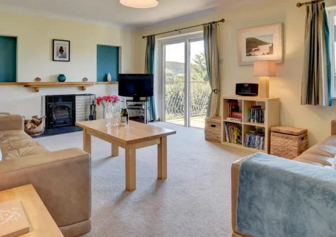 Sundowner, Croyde is a spacious four-bedroom home just 400 metres from one of North Devon's finest beaches, featuring a large balcony with sea views, enclosed garden with table tennis, and easy access to Croyde's shops and restaurants.
