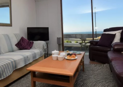 Sundowner, Nautilus, Westward Ho! is a chic one-bedroom seafront apartment with stunning Bideford Bay views. Enjoy stylish interiors, a sun-soaked patio, and the famous sandy beach right on your doorstep making it ideal for a coastal escape.