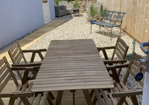 The enclosed gaden, barbecue & alfresco dining area at Sunny View, Appledore