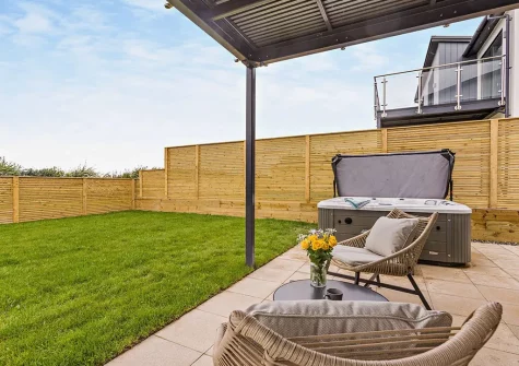 The patio, outdoor sitting area, hot tub & garden at Sunset Bay, Appledore