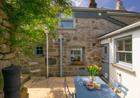 The rear patio & alfresco dining area at Sunset Farmhouse, Carnyorth