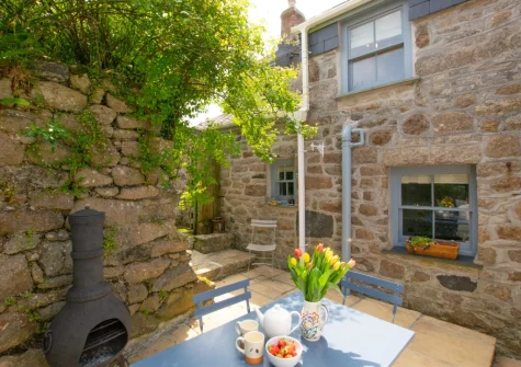 The rear patio & alfresco dining area at Sunset Farmhouse, Carnyorth