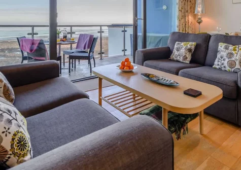 Surfers View, Westward Ho! is a stylish 2-bedroom apartment with spectacular sea views, just metres from the beach. Enjoy modern comforts, a private balcony, and easy access to North Devon's attractions for unforgettable coastal getaways.