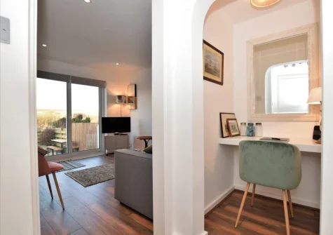 The living room & little study at Surf's Up, Widemouth Bay