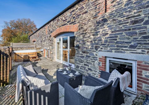 The patio, outdoor sitting area & hot tub at Swallow Barn Lakes, St Giles-on-the-Heath
