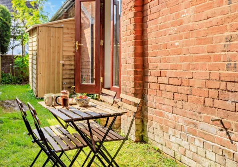 The shared garden & outdoor sitting area at Swallowfield Cottage, Newton Poppleford