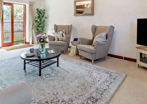 Swallowfield Cottage, Newton Poppleford is a contemporary two-bedroom bungalow ideally positioned for exploring Devon's Jurassic Coast, featuring peaceful garden stream, stylish interiors, and easy access to stunning beaches and family attractions.