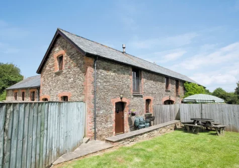 The patio, barbecue alfresco dining area & enclosed garden at Swallows Cottage, Alwington