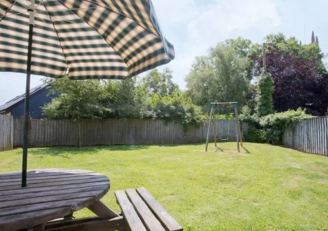The patio, barbecue alfresco dining area & enclosed garden at Swallows Cottage, Alwington