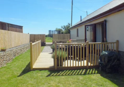 The decked patio, alfresco dining area & garden at Swallows Retreat, Edistone