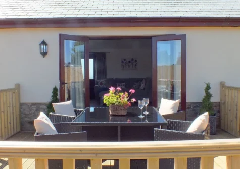 The decked patio & alfresco dining area at Swallows Retreat, Edistone