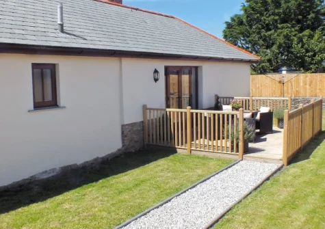 The decked patio, alfresco dining area & garden at Swallows Retreat, Edistone