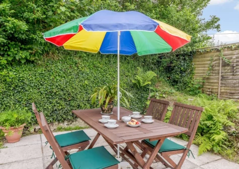 The patio & alfresco dining area at Swallows Return, Woolfardisworthy