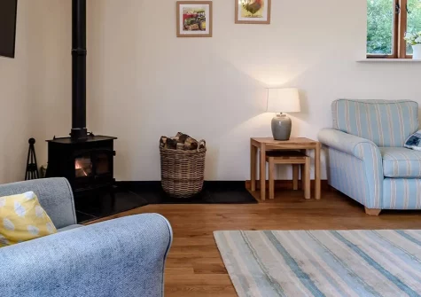 Sweetcombe Roost, Sidbury is a charming two-bedroom barn conversion retreat nestled in Devon's peaceful countryside. Enjoy cosy interiors with wood burner, enclosed garden with BBQ, and easy access to coastal adventures and family attractions.