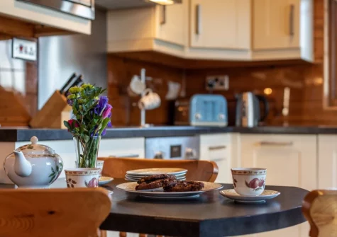 The dining area at Swift Lodge 17, Clovelly Lakes, Higher Clovelly