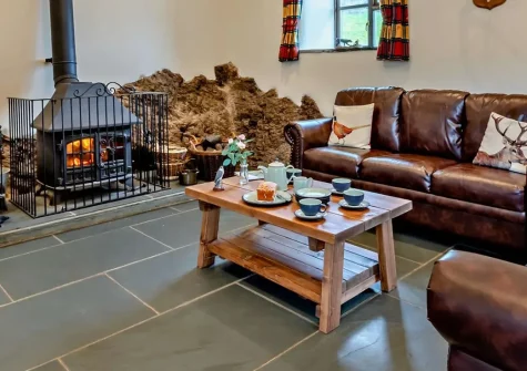 Swincombe Mill, Challacombe is a charming barn conversion on a working farm with two bedrooms, a wood fired hot tub, and decking with countryside views. Perfect for families seeking peace, nature, and outdoor adventure in Exmoor National Park.