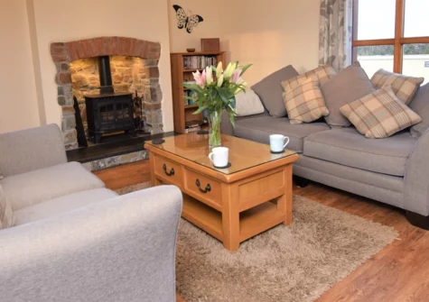 Tall Tree Cottage, Woolfardisworthy is a modern 3-bedroom barn conversion on a working farm with a hot tub, ideal for families. Situated in a rural setting with lots of countryside walks, it's an ideal base for exploring North Devon's coastline.