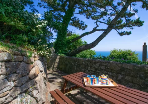 The rear terraced garden, patio & alfresco dining area at Tamarisk, Mousehole