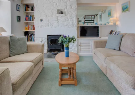 Tamarisk, Mousehole is a characterful 200-year-old cottage perched above the coast path with sweeping Mount's Bay views, terraced gardens perfect for al fresco relaxation, and the picturesque fishing village just 500 metres down the hill.