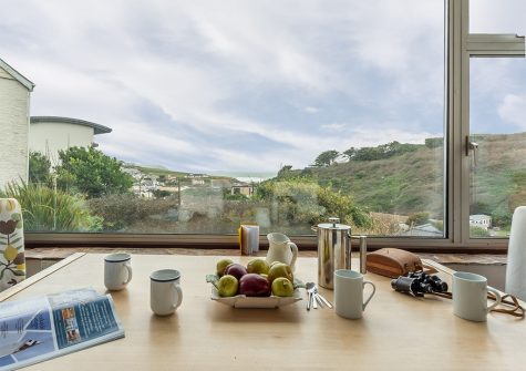 Views over the village and Polzeath beach from the dining area at Tamarisk, Polzeath