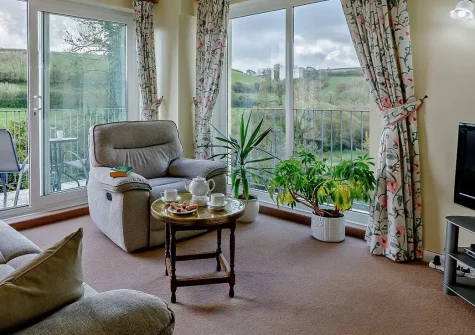 Tanglemead, West Down is a charming two-bedroom countryside apartment with a private balcony overlooking beautiful valley views. Enjoy south-facing gardens, modern amenities, and easy access to North Devon's stunning beaches and attractions.