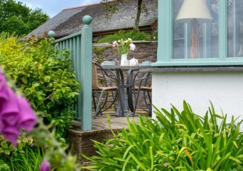 The decked patio, alfresco dining area & garden at Tanglewood Cottage, Bere Alston