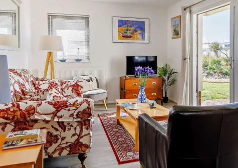 Tarka Sands, Instow is a charming two-bedroom apartment with stunning estuary views and direct access to golden sands. Perfect for families and couples seeking a relaxing coastal retreat with excellent attractions and the famous Tarka Trail nearby.