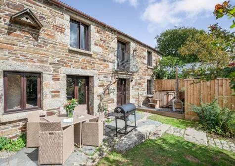 The patio, barbecue, alfresco dining area, wood fired hot tub & garden at Tawnawood, Fletchersbridge