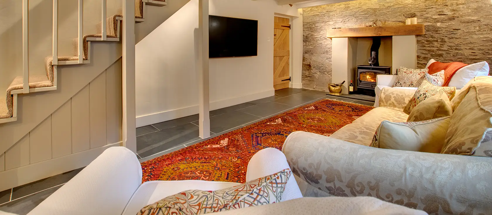 The Ancient Cottage, Looe is a charming four-bedroom stone cottage for eight in leafy grounds with riverside and woodland views. Perfect for family gatherings, it combines country charm with modern comforts and easy access to Cornish beaches.