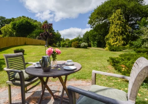 The patio, alfresco dining area & enclosed garden at The Barn, Hittisleigh