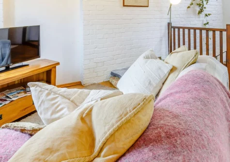 The Barn, Hittisleigh is a characterful stone conversion in peaceful Devon countryside, featuring a cosy king-size bedroom, open-plan living with Smart TV, private patio and garden, plus an acre of orchard for dogs to explore freely.