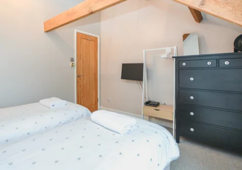 Bedroom #3, made up as two singles, at The Big Barn at Well Cottage, Jacobstow