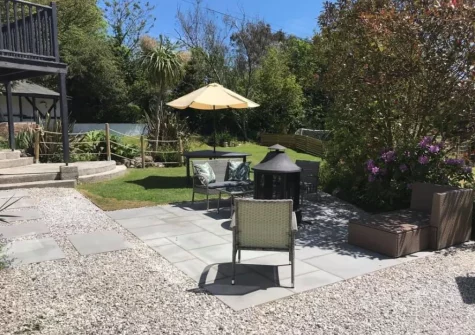 The patio, fire pit & garden at The Big Barn at Well Cottage, Jacobstow
