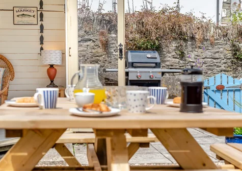 The enclosed patio, barbecue, alfresco dining area & summer house at The Blue House, 18 Glynn Road, Padstow