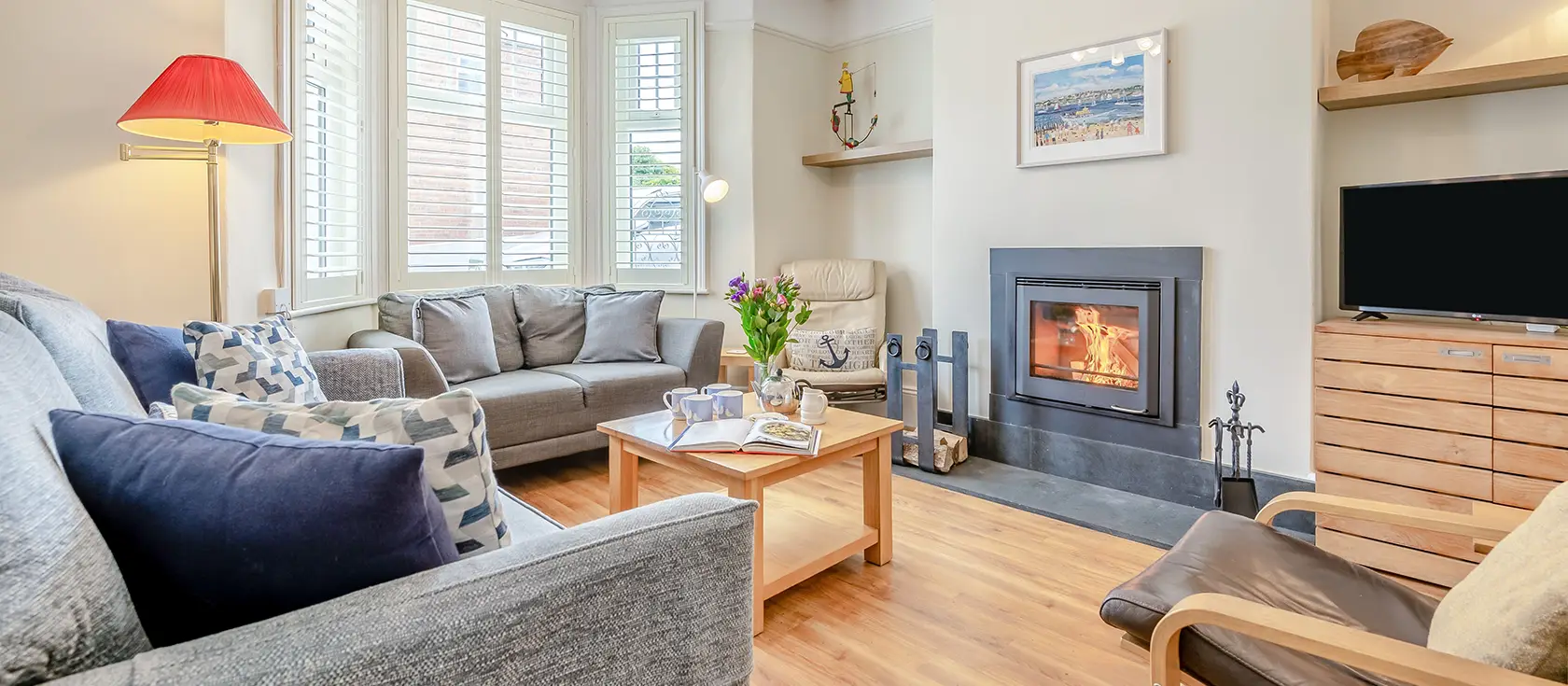 The Blue House, Padstow is a charming three-storey family retreat offering estuary views and rustic elegance. Enjoy a cosy wood burner, enclosed patio with delightful summerhouse, and easy access to Padstow's renowned seafood restaurants.