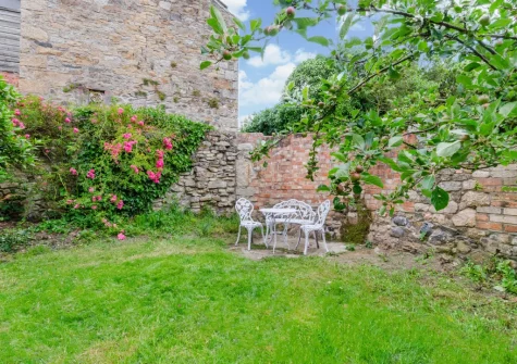 The enclosed cottage-style garden at The Blue House, Penzance